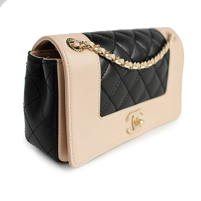 Mademoiselle Vintage Flap Bag in black and beige shiny sheepskin leather