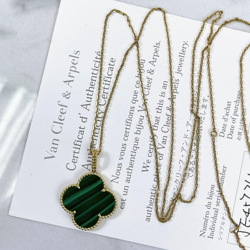 Van Cleef & Arpels, An 18K gold and malachite Magic Alhambra necklace.  Marked VCA, JE472415. - Bukowskis